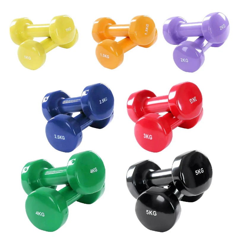 Set of colorful dumbbells with weight markings on a white background