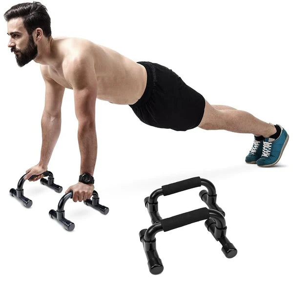 Man performing push-ups with black exercise handles on a white background