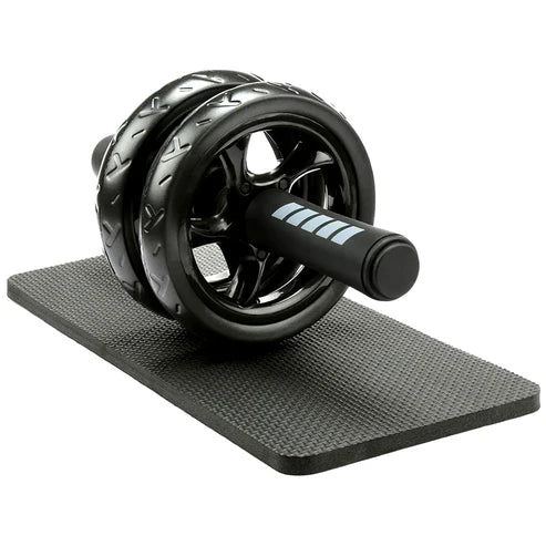 Black ab roller on a black mat with a white background