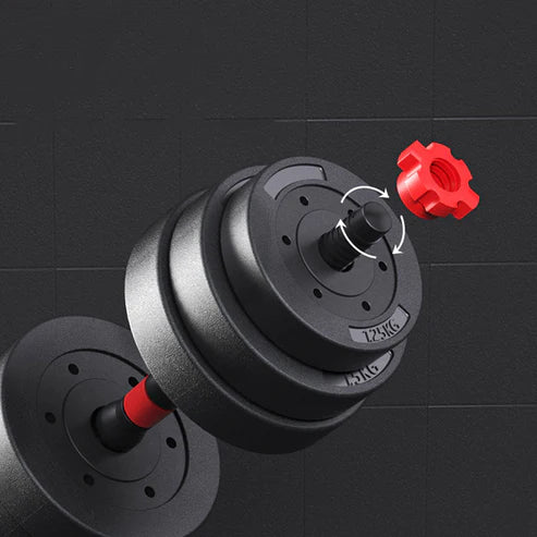 Black dumbbell with red weight plates on a black background
