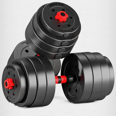 Pair of black adjustable dumbbells with red accents on a light gray background