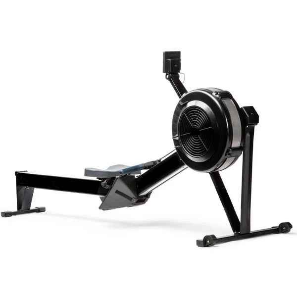 Black rowing machine on a white background
