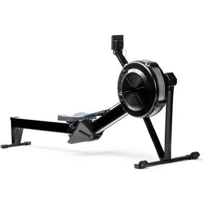 Black rowing machine on a white background