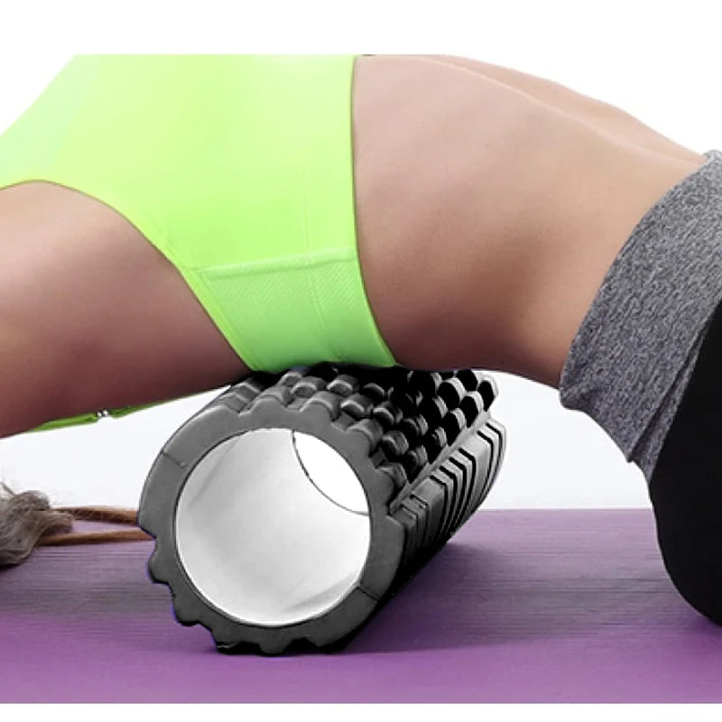 Foam roller with a woman using it for self-massage on a white background