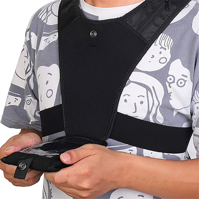 Black tactical vest with a phone pocket on a white background