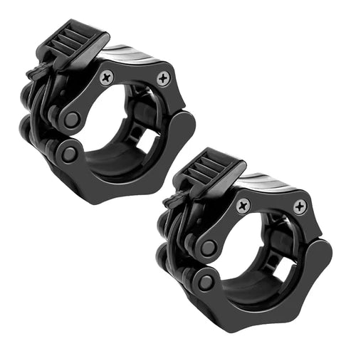 Two black metal gym rings on a white background