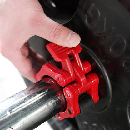 Red tire lever being used on a car tire