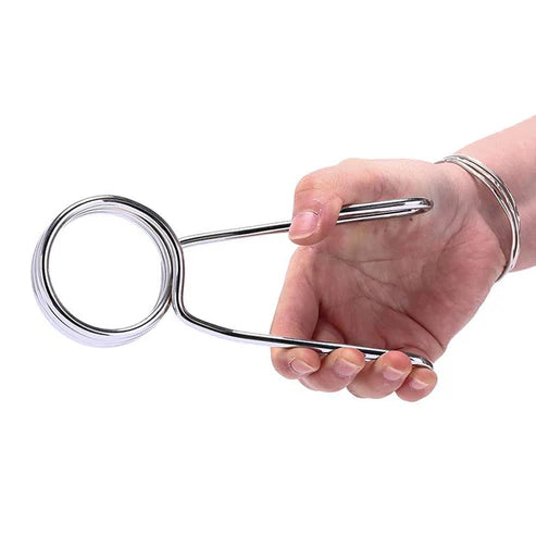 Hand holding a metal kitchen tool against a white background