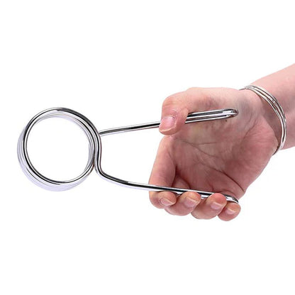 Hand holding a metal kitchen tool against a white background