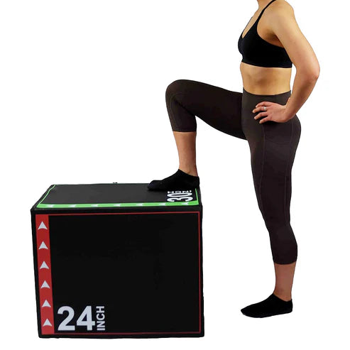 Person in black athletic wear standing on a 24-inch exercise box with visible branding.