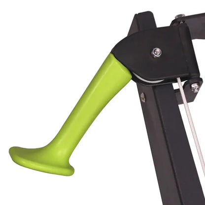 Green handle attached to a black metal structure on a white background