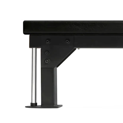 Close-up of a black metal bed frame with a white background